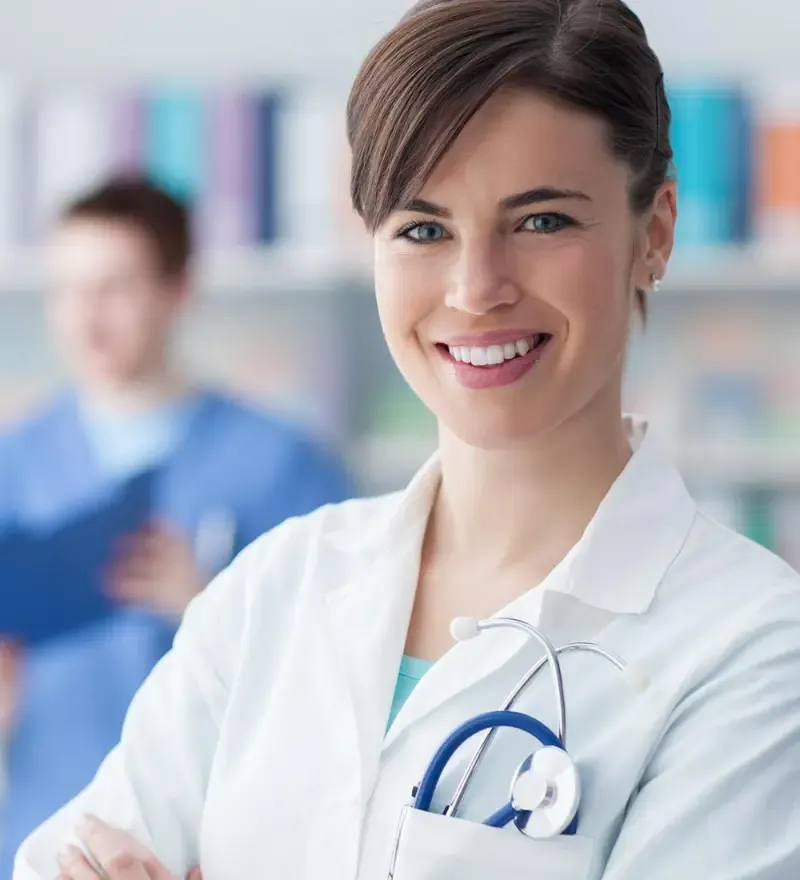 Smiling nurse in a white coat with a stethoscope